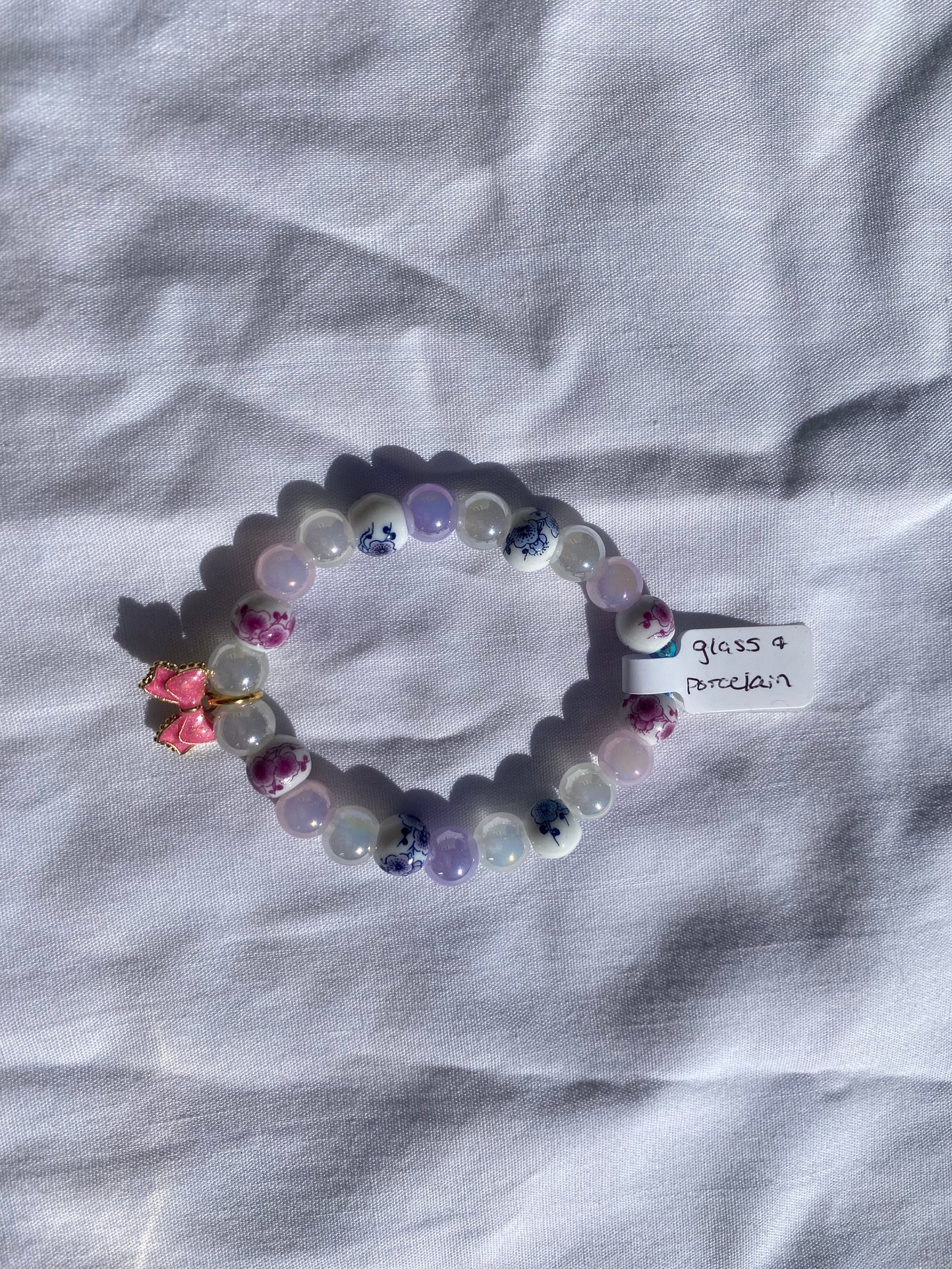 Floral Porcelain & Iridescent Glass Beaded Stretch Bracelet w/ Pink Bow Charm