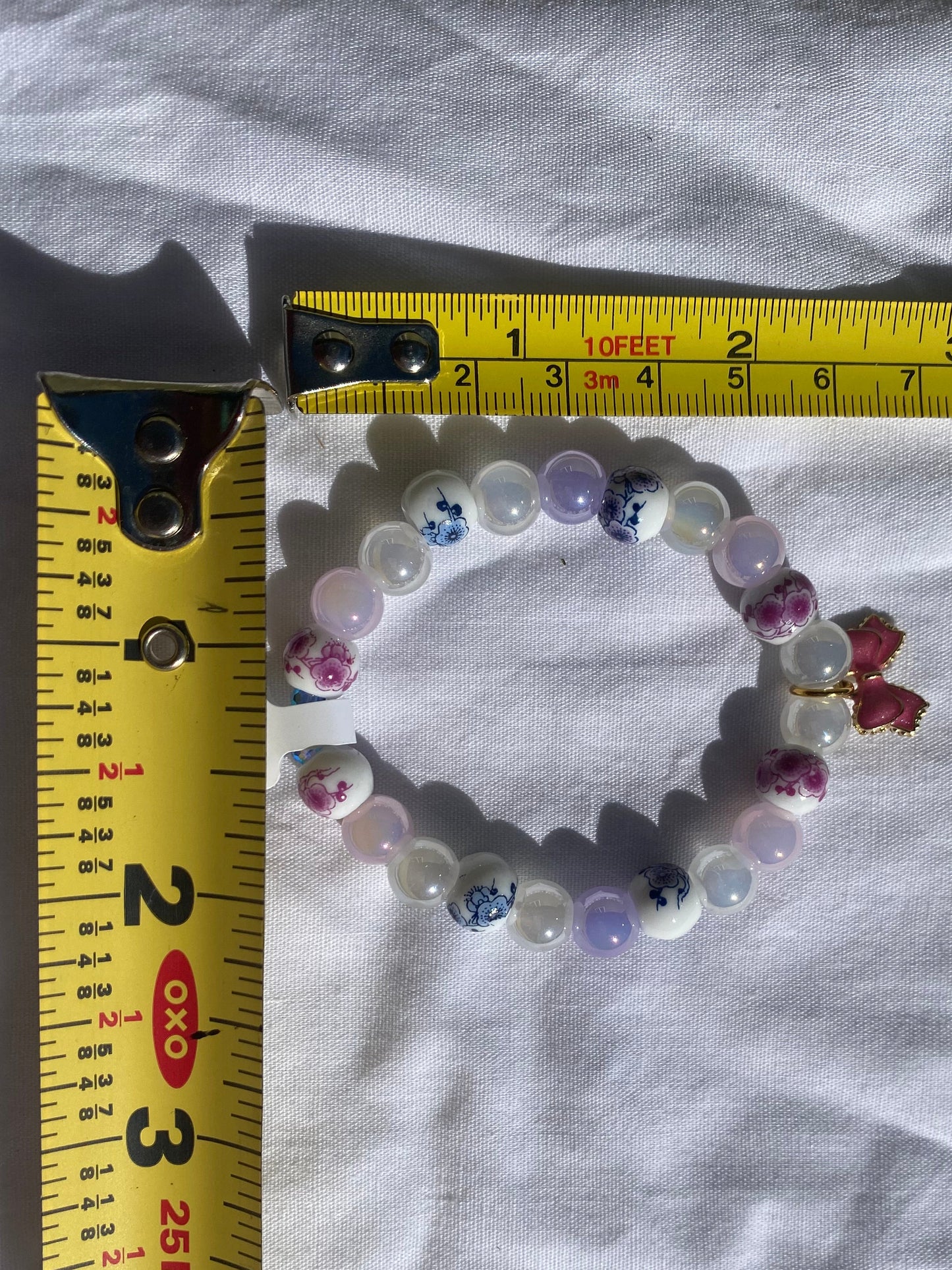 Floral Porcelain & Iridescent Glass Beaded Stretch Bracelet w/ Pink Bow Charm