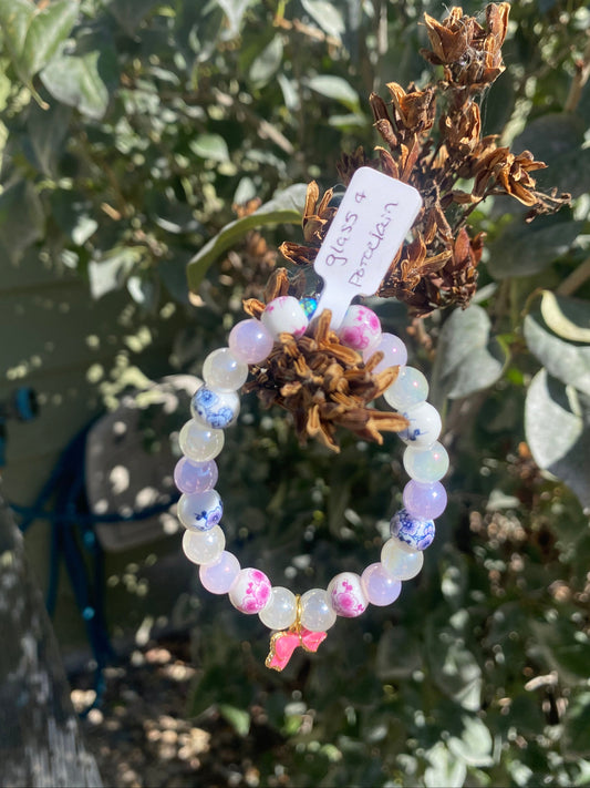 Floral Porcelain & Iridescent Glass Beaded Stretch Bracelet w/ Pink Bow Charm